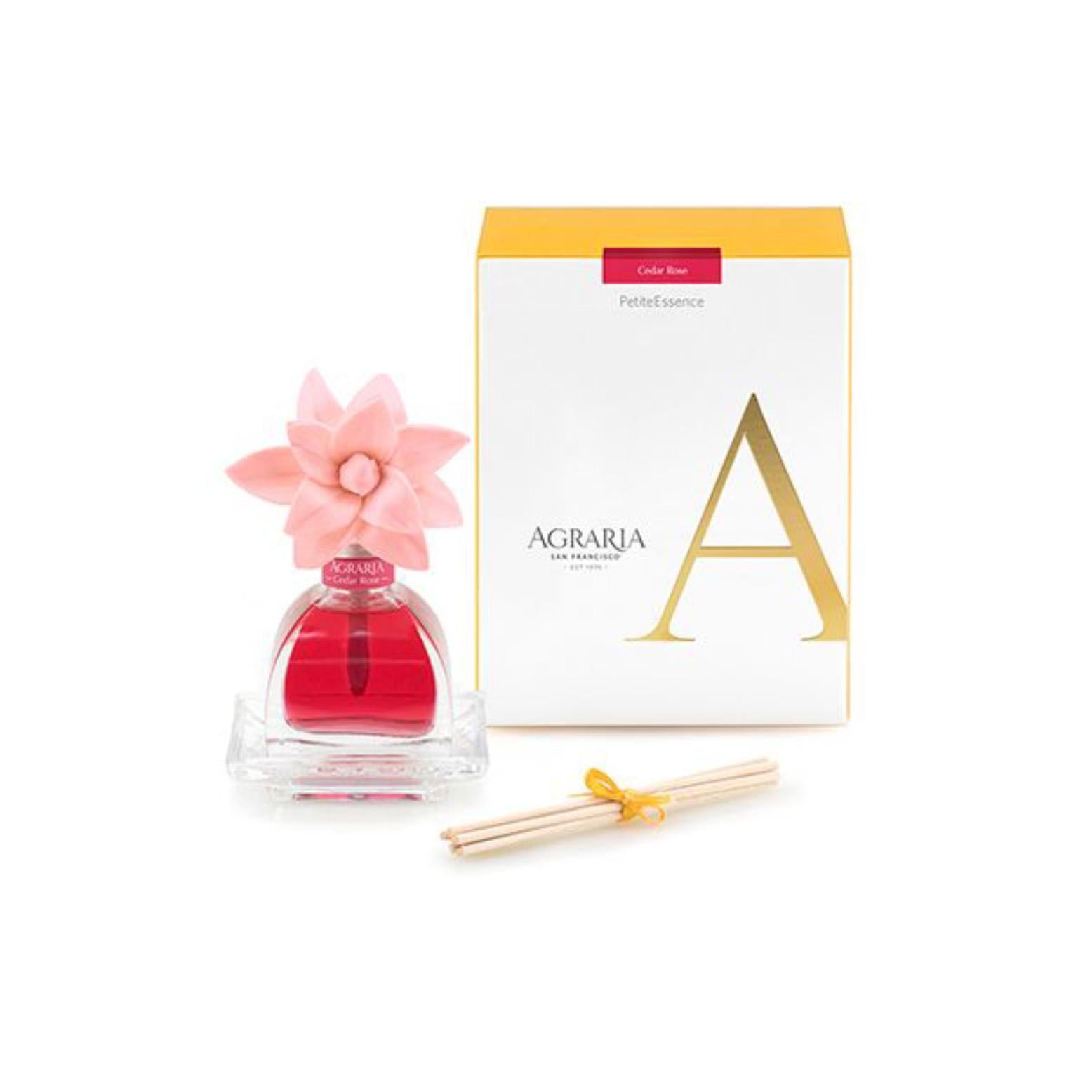 Pink scented oil in small glass jar and pink flower to disperse scent. Bamboo reeds and yellow gift box included.